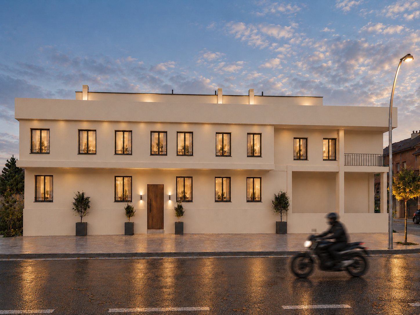 Façade de l’immeuble illuminée à la tombée de la nuit